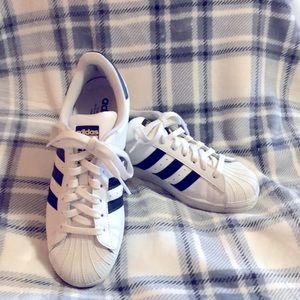 Adidas “superstar” sneakers.